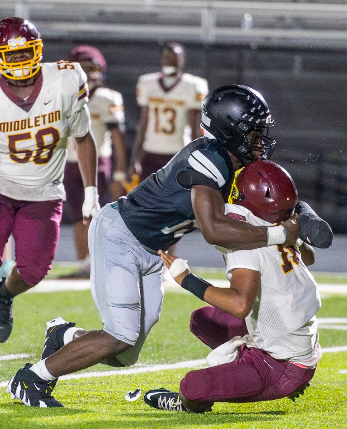 Emon Moore making a tackle during a football game