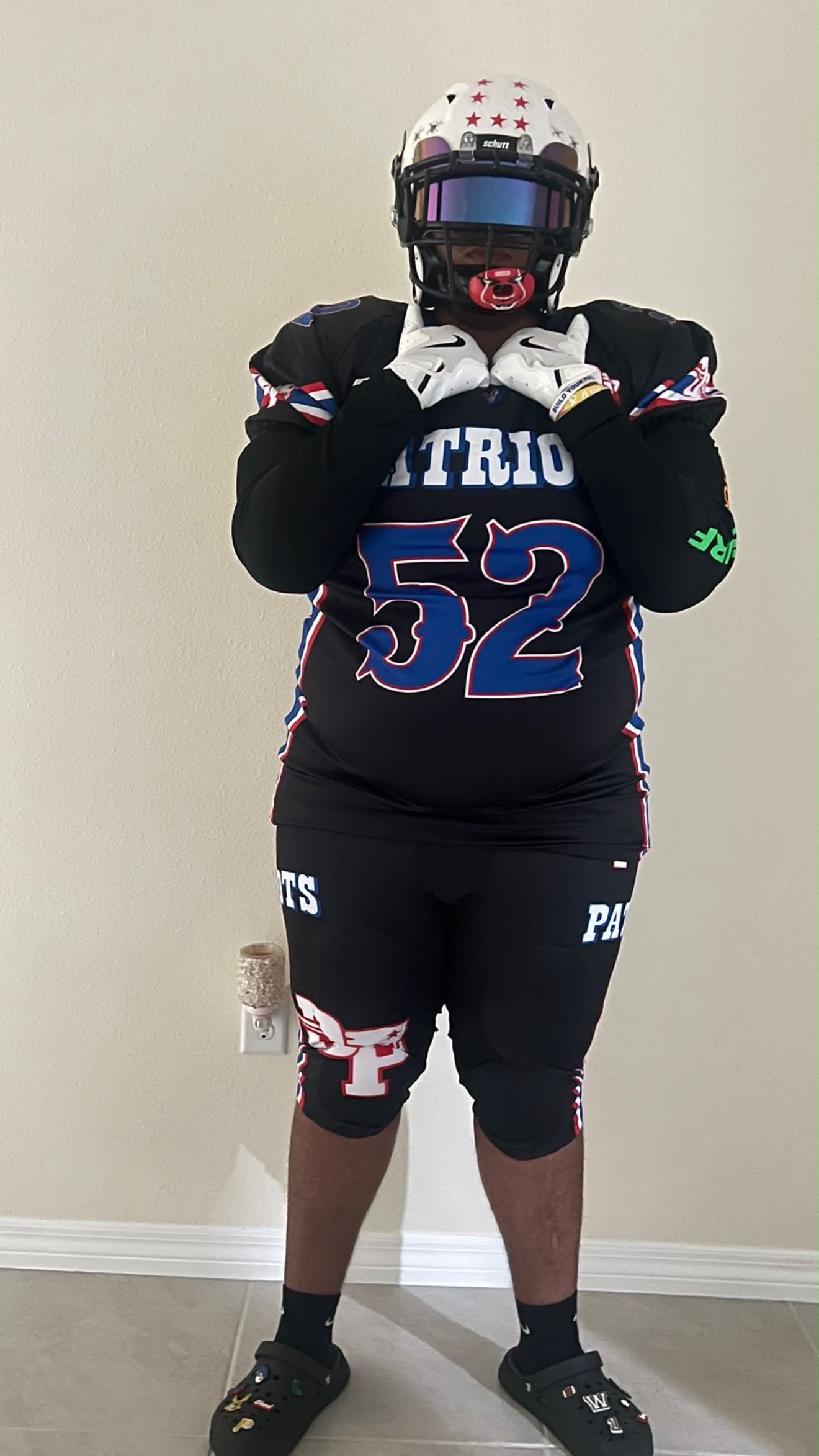Wendell Santiago wearing his football uniform and helmet